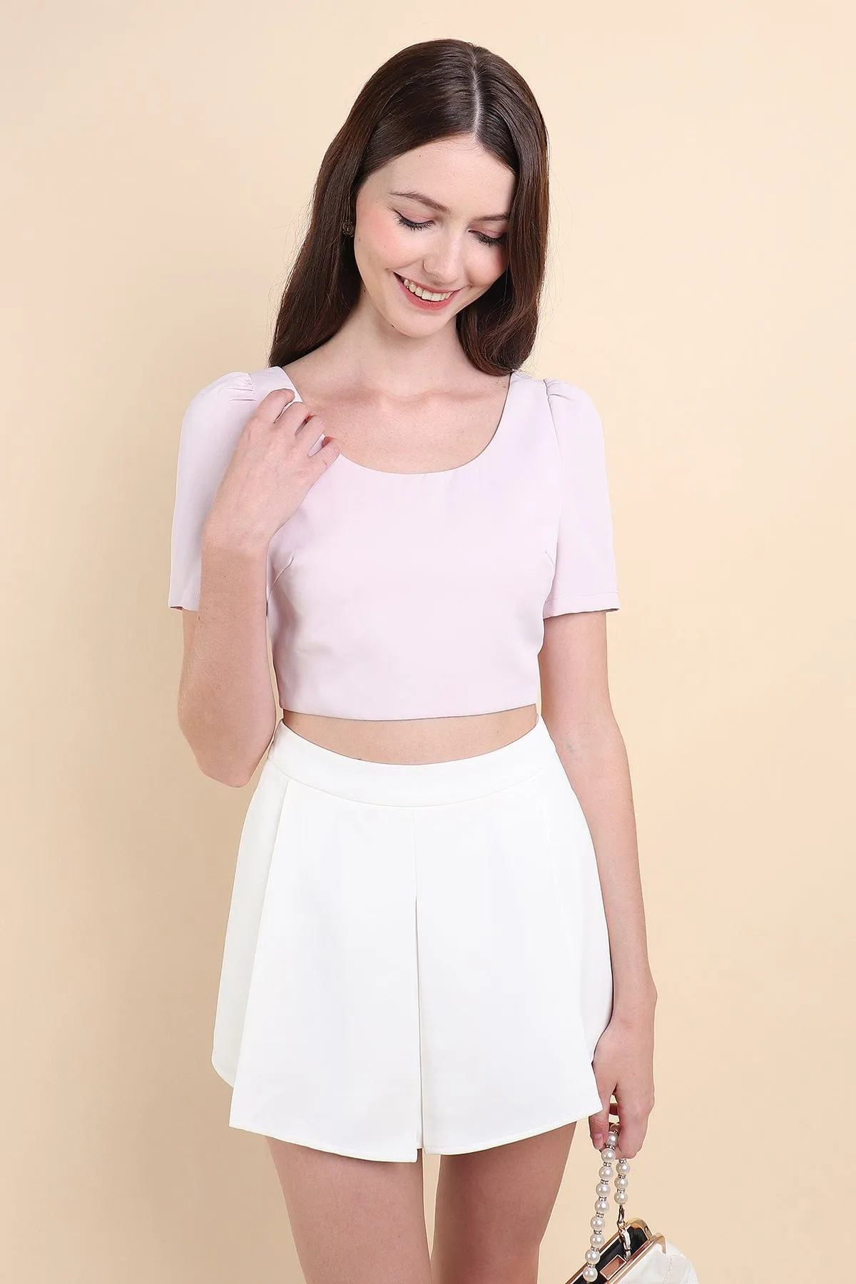 BEBE PADDED BOW OPEN BACK TOP IN PINK