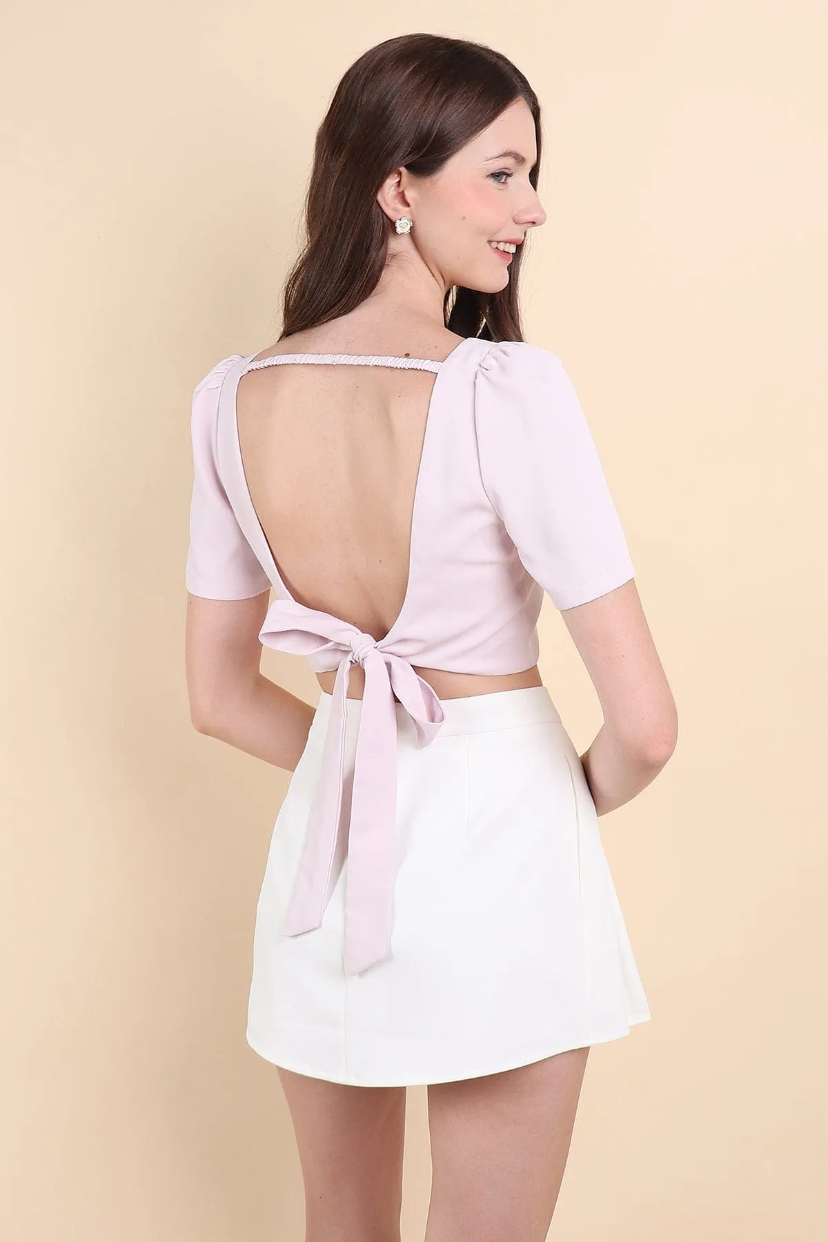 BEBE PADDED BOW OPEN BACK TOP IN PINK