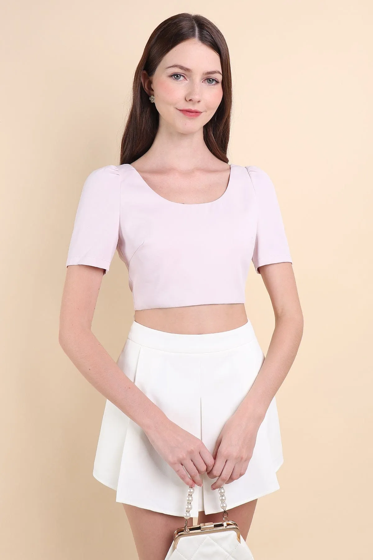 BEBE PADDED BOW OPEN BACK TOP IN PINK