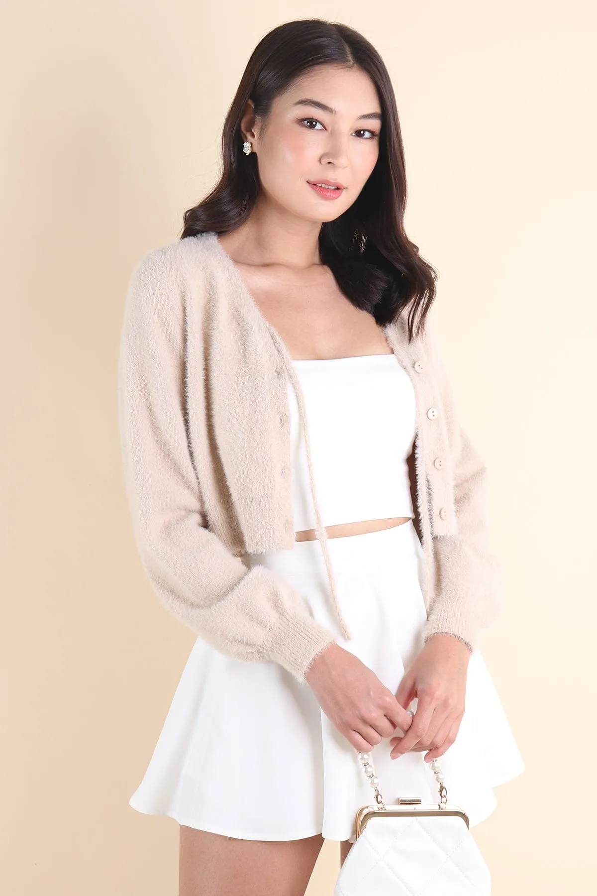 ELIZ BOW FURRY CARDIGAN IN ALMOND