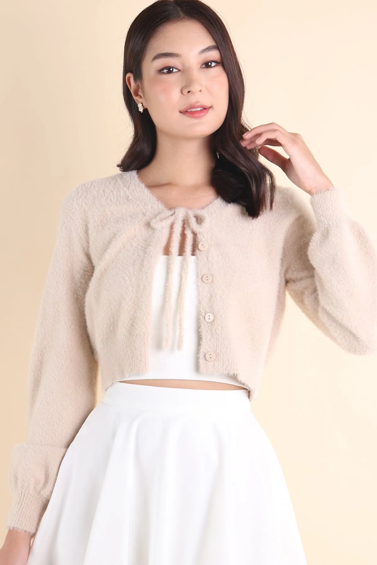 ELIZ BOW FURRY CARDIGAN IN ALMOND