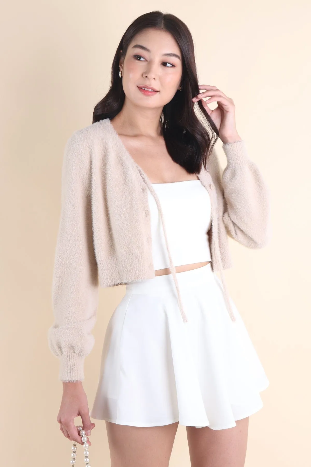 ELIZ BOW FURRY CARDIGAN IN ALMOND