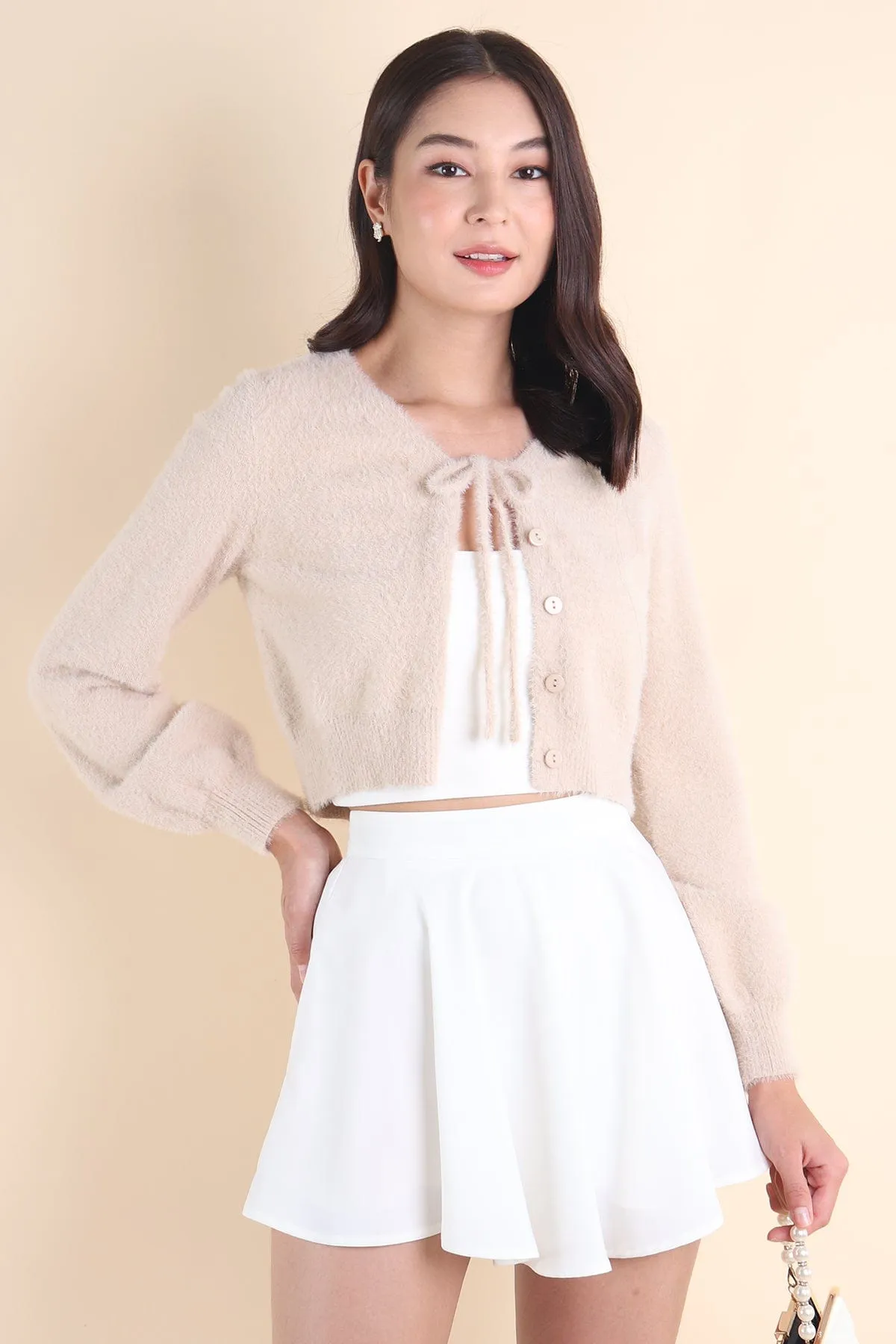 ELIZ BOW FURRY CARDIGAN IN ALMOND